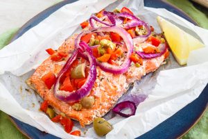 Salmon and veggies on parchment paper