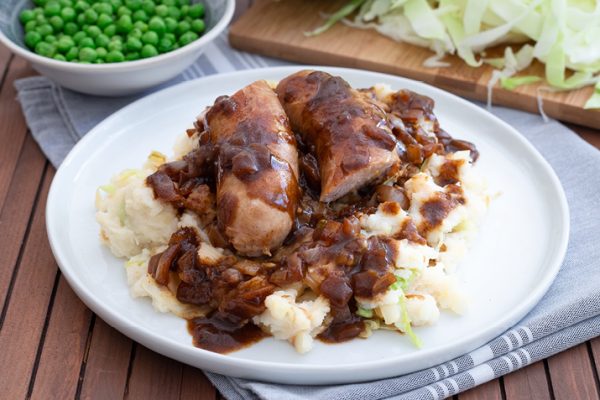 Irish Bangers and Mash - sausages with onion gravy and mashed potatoes with cabbage
