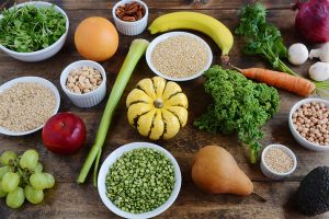 Variety of fruits, veggies, grains and beans on a table