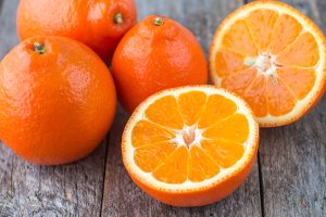 Minneola Tangelos sliced in half and whole